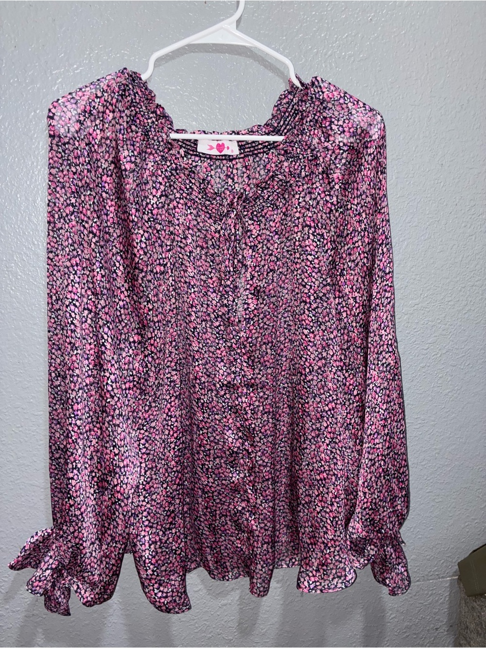 Buddy Love a pink and purple floral blouse with smocked keyhole detailing sheer.